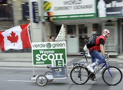 Green Party candidate for the riding of Davenport in Toronto, Wayne Scott, rides down Yonge Street during Monday's Car Free day.  