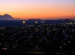 Sunset over Gordon's Bay all the way to Cape Flats Table Mounain Devils peak and even Signall Hill