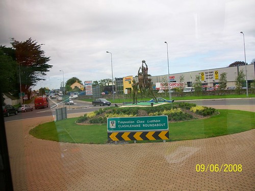 Ireland - on the road from Adare to Tralee - roundabout with sports scuplture