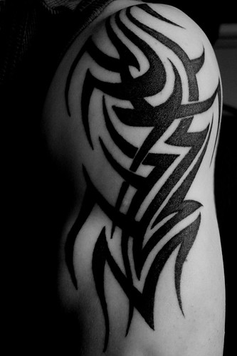 really nice tattoo man im looking for a tribal on my arm like this one too