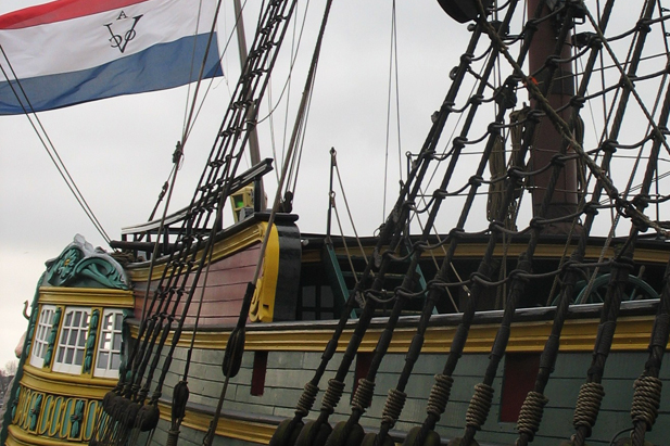 Dutch V.O.C. ship replica and Dutch flag