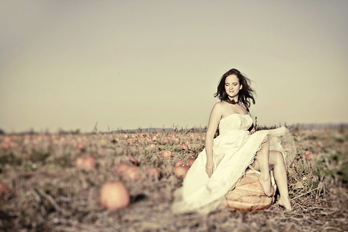 I love the look of this bride in a pumpkin patch What a perfect setting for