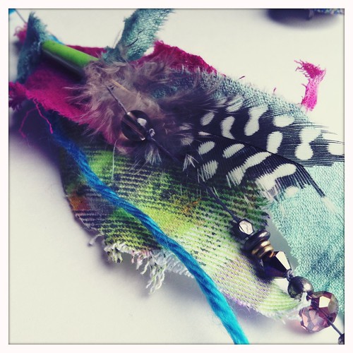 hand dyed fabric, feathers, swaroski crystals and beads