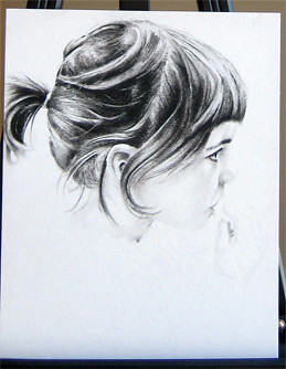 In progress photo of carbon pencil drawing entitled Clara, Profile