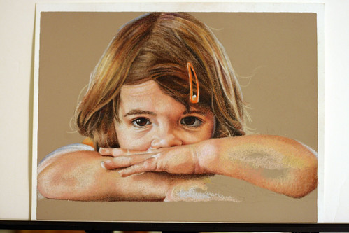 In progress photo of as yet untitled color pencil drawing of my daughter.