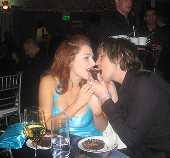 Tiffany eats a cupcake at Oscar party