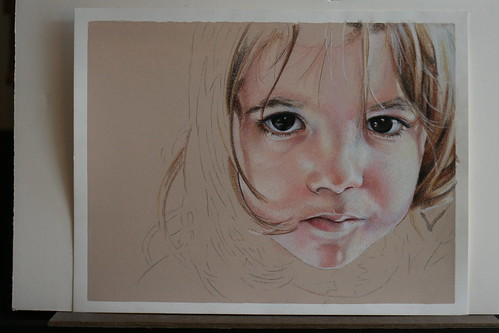 Photo of in progress colored pencil portrait of my daughter.