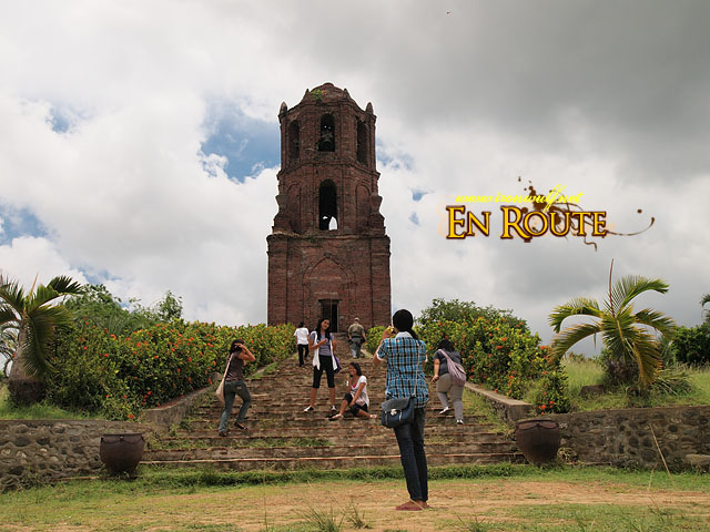 A group of tourist being touristy at Bantay Tower