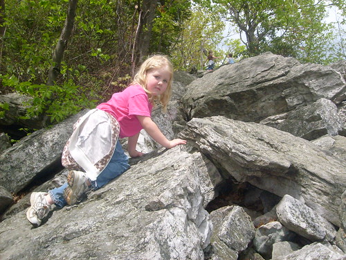 Anna climbs rocks