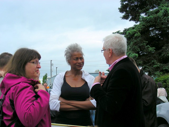 Harriet Drummond & Elvi Gray-Jackson talking with Pride parade Grand Marshal Doug Frank