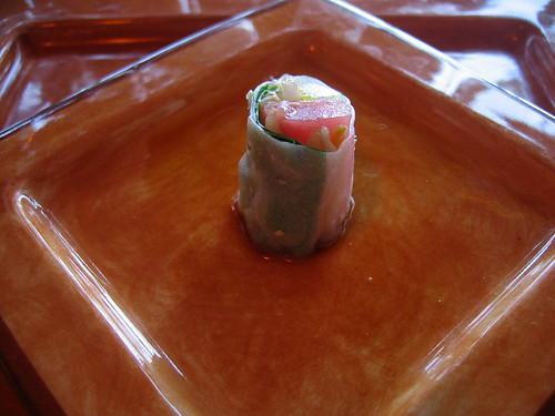Amuse bouche of rice paper-wrapped tuna and bean sprouts