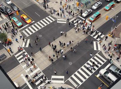 Pedestrians have taken to the scramble at Yonge and Dundas Streets, Toronto