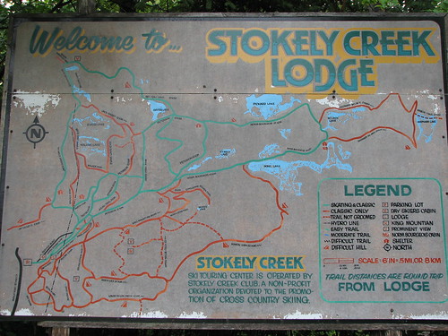 Stokely Creek Lodge sign and trail map