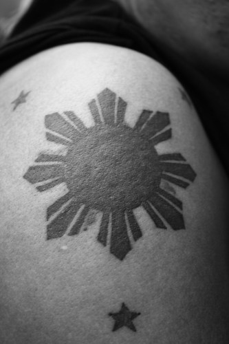sun tattoo. 3 Stars in the sun tattoo
