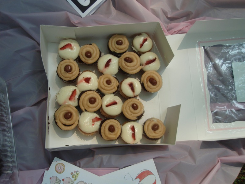 Kumquat Cupcakery mini strawberry and chocolate/peanut butter cupcakes