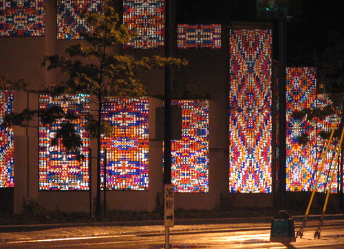 Sound of Light by the late Richard Elliott, as seen at night, lit up by the lights of passing cars. You can only see this artwork while traveling north on MLK. Photo by Wendi.