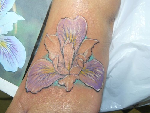 Iris tattoos are favored by women who have great admiration for the beauty
