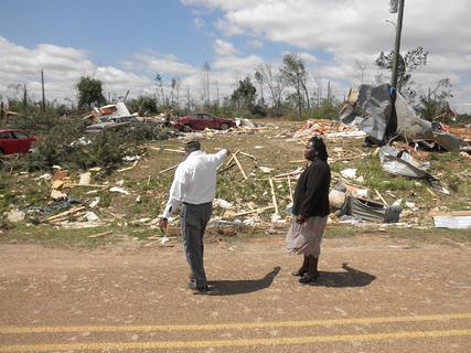 State Director Trina N. George inspects damages in Holmes County after a tornado. 