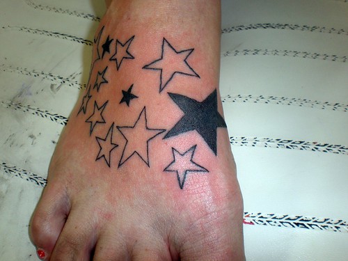 Small shooting star tattoo on foot Labels free foot star tattoo designs