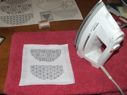 Iron on the interfacing on the reverse side of your stitching
