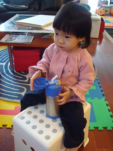 Sometimes, when I am packing the stuffs, Erika will sit like this and watch her favorite  Baby Einstein videos.