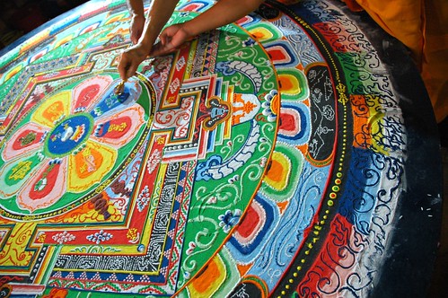 His Holiness Dagchen Rinpoche's hand holds a vajra drawing lines that close the Hevajra Mandala, after the empowerment, Tharlam Monastery of Tibetan Buddhism, Boudha, Kathmandu, Nepal