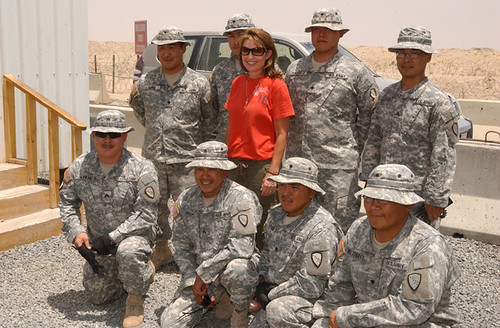 Sarah Palin posing with the troops