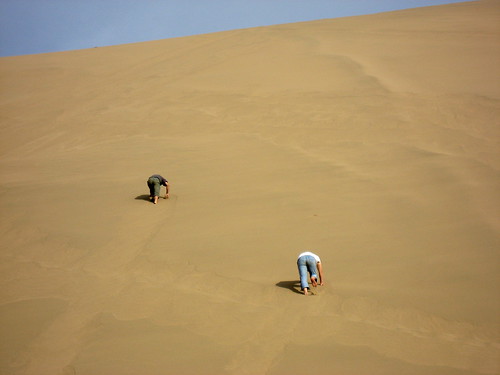 Kkkk and Quan climbing the dune