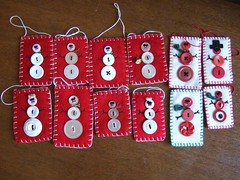 Felted sweater and blanket ornaments--red and white button snowmen