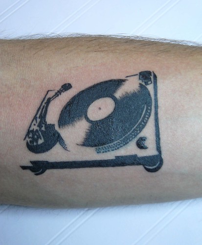DJ EvadE's turntable tattooThe only turntable where no scratching is 
