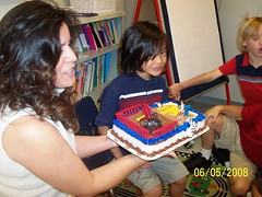 Mrs. Tank holds Troy's cake as the class sings "Happy Birthday"!
