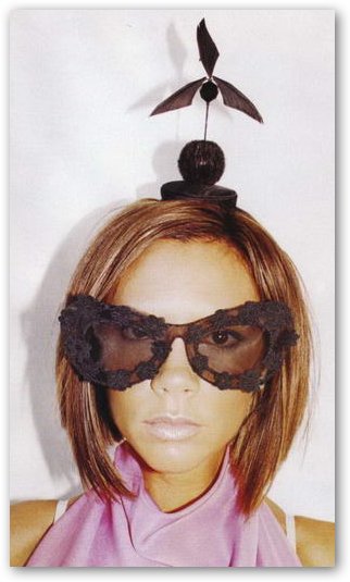 Victoria Beckham with Strange Headgear and Sunglasses