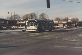 Southbound CTA 1970's era GMC Fishbowl windshield bus at the intersection of West 111th Street and South Pulaski Road in Chicago's Mount Greenwood neighborhood. Chicago Illinois. December 1986.