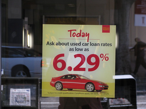 A sign at a car dealer advertising low interest rates