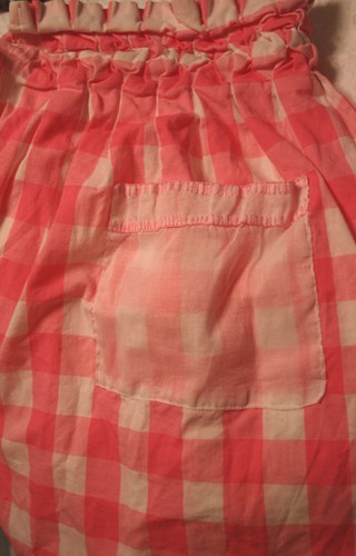 pink and white apron