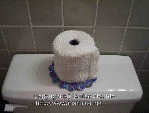 A toilet paper roll cover that looks like, well, a roll of toilet paper