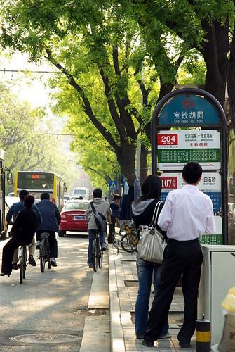 Checking bus routes on Gulou Dongdajie, Beijing