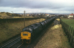 Class 37 no. 6894 with oil tankers between Prestwick & Ayr, southbound, March 1974.  A. Wilson