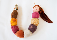 Caterpillar doll with brown hat