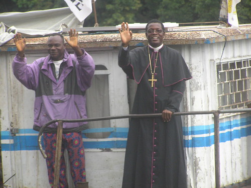 The Bishop and an abbot wave goodbye
