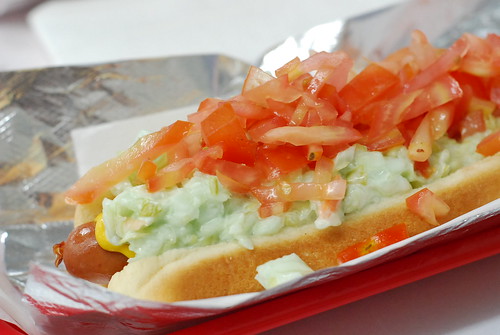 coleslaw dog with tomato and mustard