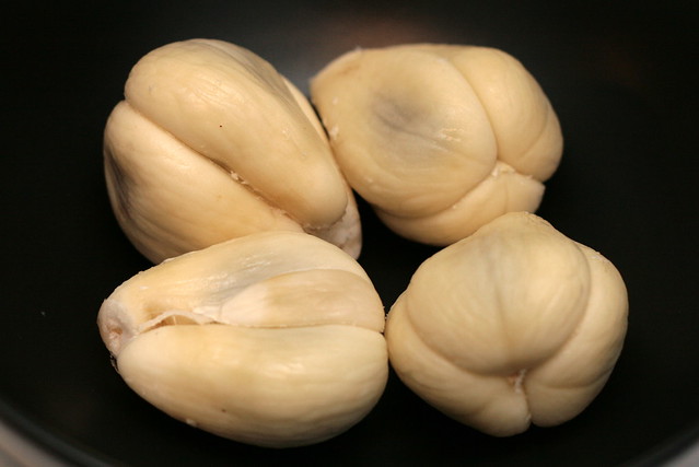 The peeled buah salak or snake fruit has large fleshy lobes