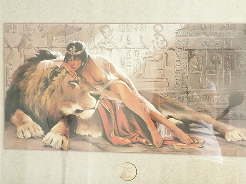 Lady with baps out atop lion