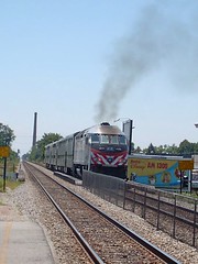 Southbound Metra commuter local departing the Forest Glen commuter flagstop depot. Chicago Illinois. June 2007.
