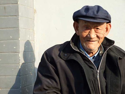 A friendly 85 year-old, sitting outside his home in one of the hutongs near Yonghegong 