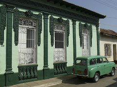 Old car and matching house in Trinidad