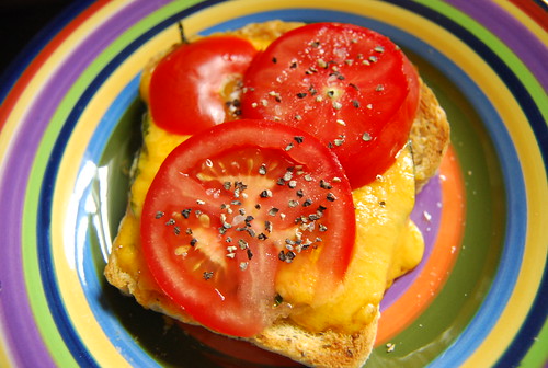 Toast with cheese, basil and tomato