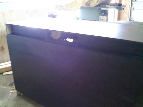 This is the back side (rather, front) of the desk. You can see the cutouts for 4 case fans.
