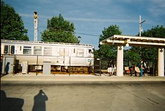 A bright and sunny summer morning at the CTA Dempster Street station. Skokie Illlinois. July 2008<br />.