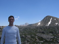 Dennis on Flattop Mtn, Hallet's Peak to Right, Long's Peak in Background